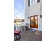 Outdoor seating area on a home's deck with nice views and a wooden double-door entrance at 146 S Battery St, Charleston, SC 29401