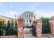Wrought iron gate provides a secure and stylish entrance to this charming home and patio at 146 S Battery St, Charleston, SC 29401