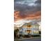 Exterior of a charming two-story home featuring a welcoming front porch and classic architectural details at 146 S Battery St, Charleston, SC 29401