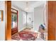 Warm and inviting foyer showcasing an entry rug, hardwood floors, and an entry to a living room at 146 S Battery St, Charleston, SC 29401