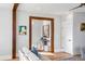 Bright hallway with wood trim and recessed lighting, leading to additional rooms within the home at 146 S Battery St, Charleston, SC 29401