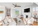 Bright living room with fireplace, wood floors, and comfortable seating, illuminated by natural light at 146 S Battery St, Charleston, SC 29401