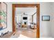 Bright, open-concept living room with modern furniture and a fireplace framed with white molding at 146 S Battery St, Charleston, SC 29401