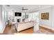 Cozy living room with fireplace, wood floors, and comfortable seating, bathed in natural light at 146 S Battery St, Charleston, SC 29401