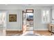 Living room view showing open door to deck and eclectic decor at 146 S Battery St, Charleston, SC 29401