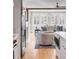 The kitchen opens up to a comfortable living room, with hardwood floors, and neutral colored furnishing at 146 S Battery St, Charleston, SC 29401