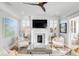 Living room featuring fireplace, stylish furniture, and ample lighting at 146 S Battery St, Charleston, SC 29401