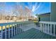 View from backyard deck showcasing a beautiful, well-maintained, fenced green backyard and a patio space at 1466 Arrow Wind Ter, Charleston, SC 29414