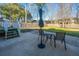 A spacious backyard patio with outdoor seating, perfect for entertaining, with a well-maintained green lawn at 1466 Arrow Wind Ter, Charleston, SC 29414