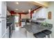 Bright kitchen featuring white cabinets, stainless steel appliances, granite countertops, and a breakfast bar at 1466 Arrow Wind Ter, Charleston, SC 29414
