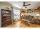 Cozy living room with a comfortable sofa, built-in shelving, and ample natural light at 1466 Arrow Wind Ter, Charleston, SC 29414