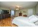 Spacious main bedroom with wood floors, a ceiling fan, and natural light at 1466 Arrow Wind Ter, Charleston, SC 29414