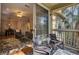 Balcony with outdoor seating leading to a living room with hardwood floors at 1600 Long Grove Dr # 1727, Mount Pleasant, SC 29464