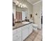 A well-lit bathroom features tan granite counters, tile floor, and open doorway at 1600 Long Grove Dr # 1727, Mount Pleasant, SC 29464