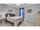 A modern bedroom features a queen bed, neutral walls, and carpet flooring at 1600 Long Grove Dr # 1727, Mount Pleasant, SC 29464