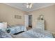 A bright bedroom showcases two twin beds, a white dresser, and carpet flooring at 1600 Long Grove Dr # 1727, Mount Pleasant, SC 29464