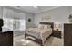 A comfortable bedroom showcases a queen bed, neutral walls, and large window at 1600 Long Grove Dr # 1727, Mount Pleasant, SC 29464