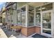 Charming cafe exterior with outdoor seating and brick accents, 'Saveurs Du Monde Cafe' at 1600 Long Grove Dr # 1727, Mount Pleasant, SC 29464