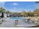 Community pool with lounge chairs and surrounding residential buildings on a sunny day at 1600 Long Grove Dr # 1727, Mount Pleasant, SC 29464