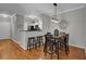 Inviting dining area with hardwood floors seamlessly connects to the kitchen and living spaces at 1600 Long Grove Dr # 1727, Mount Pleasant, SC 29464