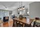 Open-concept dining room with modern lighting and hardwood floors, perfect for entertaining at 1600 Long Grove Dr # 1727, Mount Pleasant, SC 29464
