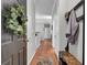 View of entryway with coat rack, shoe bench, and hardwood floors at 1600 Long Grove Dr # 1727, Mount Pleasant, SC 29464
