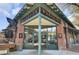 A brick building has large windows, green trim and a wood awning at 1600 Long Grove Dr # 1727, Mount Pleasant, SC 29464