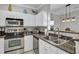 Well-equipped kitchen features stainless steel appliances, granite countertops, and ample cabinet space at 1600 Long Grove Dr # 1727, Mount Pleasant, SC 29464