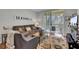 Cozy living room features a plush sofa, stylish decor, and sliding doors to a private balcony at 1600 Long Grove Dr # 1727, Mount Pleasant, SC 29464