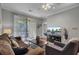 Living room featuring a sofa, lounge chair, and mounted television at 1600 Long Grove Dr # 1727, Mount Pleasant, SC 29464