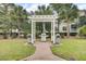 Outdoor kitchen area with grills and a central island under a pergola, perfect for entertaining guests at 1600 Long Grove Dr # 1727, Mount Pleasant, SC 29464