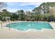 Inviting community pool surrounded by comfortable lounge chairs, perfect for relaxation and enjoying the outdoors at 1600 Long Grove Dr # 1727, Mount Pleasant, SC 29464