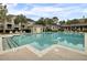 Refreshing community pool surrounded by lush landscaping offers a serene oasis for residents to unwind at 1600 Long Grove Dr # 1727, Mount Pleasant, SC 29464