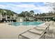 Beautiful community pool area with lounge chairs offers the perfect place to soak up the sun and enjoy outdoor living at 1600 Long Grove Dr # 1727, Mount Pleasant, SC 29464