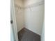 Interior view of a carpeted walk-in closet with metal shelving at 2204 Scarlett Maple St, Summerville, SC 29486