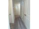 Hallway featuring neutral walls, carpet flooring, and white doors at 2204 Scarlett Maple St, Summerville, SC 29486