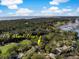 Panoramic aerial shot of 176 Marsh Hawk surrounded by a golf course, marshlands and ocean views at 176 Marsh Hawk Ln, Kiawah Island, SC 29455
