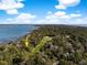 Breathtaking aerial view of a golf course community surrounded by water and lush forest at 176 Marsh Hawk Ln, Kiawah Island, SC 29455