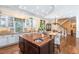 Gourmet kitchen with white cabinets, wood island, and stainless steel sink at 176 Marsh Hawk Ln, Kiawah Island, SC 29455