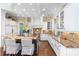 Bright kitchen with island seating, stainless steel appliances, and white cabinets at 176 Marsh Hawk Ln, Kiawah Island, SC 29455