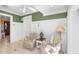 Comfortable sitting area features olive green walls, soft armchairs and a decorative table lamp at 176 Marsh Hawk Ln, Kiawah Island, SC 29455
