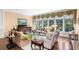 Elegant living room with seating, window, and natural light at 176 Marsh Hawk Ln, Kiawah Island, SC 29455