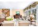 Bright living room with a large picture window and staircase at 176 Marsh Hawk Ln, Kiawah Island, SC 29455