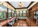 Spacious home office with natural light, custom built-ins, and wood floors at 176 Marsh Hawk Ln, Kiawah Island, SC 29455