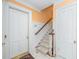 Entryway features stairs with wood handrail, leading to upper level at 176 Marsh Hawk Ln, Kiawah Island, SC 29455