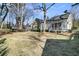 Spacious backyard with a well-maintained lawn and mature trees at 1992 Pierce St, Charleston, SC 29492