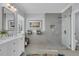 Modern bathroom features a large frameless shower, double vanity, and a soothing color palette at 1992 Pierce St, Charleston, SC 29492