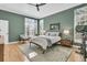 Beautifully designed bedroom with natural light, hardwood floors, and a cozy sitting area at 1992 Pierce St, Charleston, SC 29492