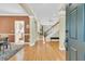 Bright foyer with hardwood floors, leading to an open-concept living area and staircase at 1992 Pierce St, Charleston, SC 29492