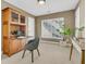 Bright office space with a built-in desk, storage, and a large window at 1992 Pierce St, Charleston, SC 29492